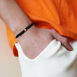 BRACCIALE TESSUTO NERO CON LETTERA - ORO18KT - Shine gioielli